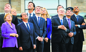 NATO leaders watch a flypast of military aircraft on the second day of the NATO Summit in Newport, South Wales, on Friday