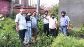 Members of Industrial Estate Entrepreneurs Association show the spot where electricity meter should have been installed.