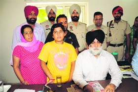 DSP Gurjit Singh Romana with Harshit Grover, who had gone missing, in Bathinda on Saturday