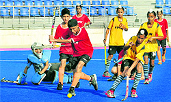 A match in progress between Surjit Hockey Academy, Jalandhar, and Baba Uttam Singh Hockey Academy, Khadoor Sahib, at Hockey Stadium in Mohali on Saturday