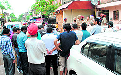 Police officials and residents outside the house of Naib Singh at Mohali