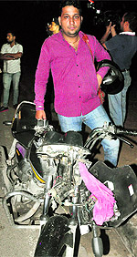Mohit, who chased the fleeing driver, with his damaged bike