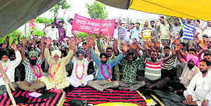 Protesters stage a dharna in Lalru on Saturday
