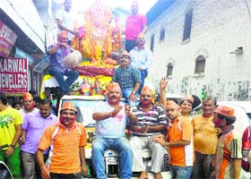 An idol of Lord Ganesha being taken out in a procession for immersion in the Banner river in Kangra on Saturday