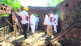 DCC(R) Amritsar president Gurjeet Singh Aujla at the spot where five members of a family died in a house collapse due to heavy rain in Jassonangal village recently.