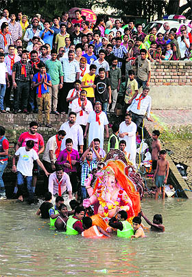 Devotees assemble near the Sirhind Canal to witness the immersion of Lord Ganesha in Bathinda.