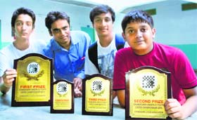 (From extreme left) Chess players Rahul Arora, Jaskeerat Singh, Varun Gupta and Anubhav Tuknayat with their trophies at St Xaviers Senior Secondary School in Chandigarh on Sunday