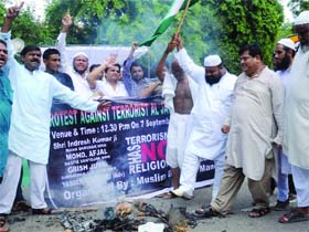 Activists of the Muslim Rashtriya Manch protest against terrorism in New Delhi on Sunday.