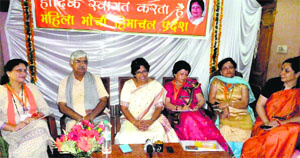 BJP National Mahila Morcha president Vijaya Rahatkar (centre) addresses mediapersons in Kullu on Sunday.