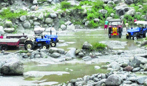 Illegal mining continues unabated in the Neugal and Awa rivers of Palampur.