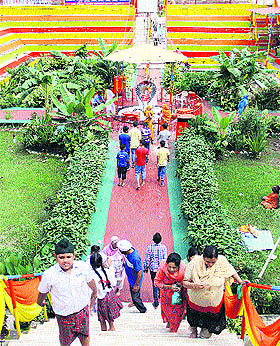 Devotees visit the bedecked temple in Jalandhar on Sunday.