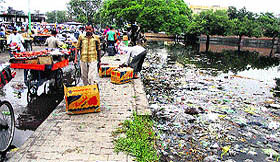  Buyers at the Sabzi Mandi in Maqsudan had to pass through garbage and slush after three days of rain in Jalandhar.