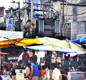 Vendors have installed their fast food vends under power transformers at Rainak Bazar in Jalandhar. 