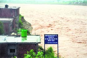 A colony on the bank of the Tawi inundated in Jammu on Sunday