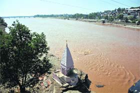 Water recedes: The water level of the Tawi has gone below the danger mark a day after floods in Jammu on Sunday