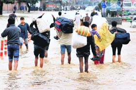 People move to safer places in Srinagar on Sunday