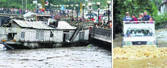 Flood ferocity in Valley: People look at a damaged houseboat on the Jhelum in Srinagar on Sunday; and (right) tourists move to a safer area in Srinagar