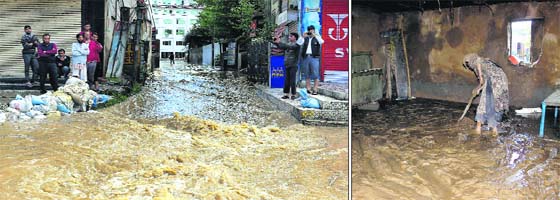An elderly woman tries to clean her flood-hit house at Sura Chak in Jammu; and (right) people watching swirling floodwaters at Regal Chowk in the heart of Srinagar on Sunday