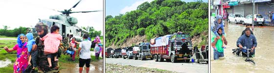 RESCUE WORK: Indian Air Force helicopters evacuate flood-hit people to safer places in the Jammu region; and stranded trucks wait for the National Highway to be opened near Sidhra Road in Jammu on Sunday; A Kashmiri man evacuates an elderly woman to a higher ground on a flooded road in Srinagar on Sunday