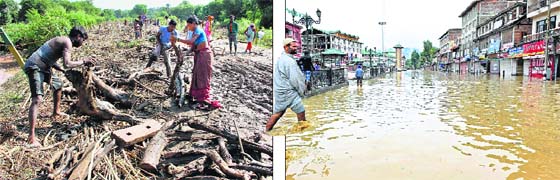 In deep waters: People try to salvage their belongings in flood-ravaged Raipur Satwari in Jammu; a man wades through a waterlogged street near Lal Chowk in Srinagar on Sunday. PTI