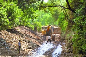 Picking up pieces: Restoration in progress on the national highway in Jammu on Sunday