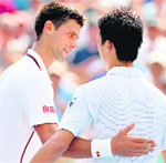 Novak Djokovic congratulates Kei Nishikori after their semifinal in New York on Saturday. Nishikori won 6-4 1-6 7-6 6-3