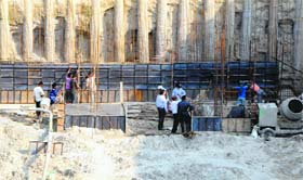Workers engaged in construction of the ongoing Durgiana Temple beautification project in Amritsar.