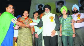 International basketball player and a student of Govt Girls Senior Sec School, Gagandeep Kaur, being felicitated in Amritsar.