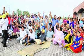 Computers teachers protest in support of their demands in Bathinda on Monday