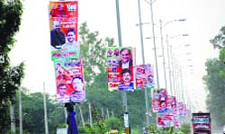 Political hoardings dot a highway passing through Rohtak. Photo: Manoj Dhaka 
