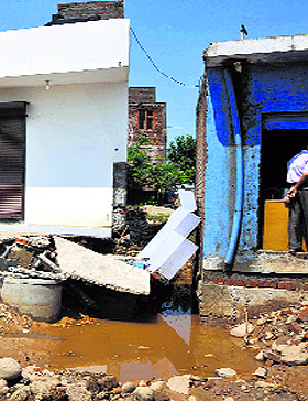A shop that got damaged due to flash floods in Jammu on Monday.