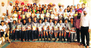 Students who were felicitated by Amar Shaheed Memorial Library at Latala village near Mandi Ahmedgarh.