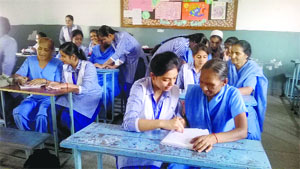 Students play teacher during the International Literacy Day celebrations on the GMT campus