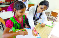 A student of DAV Public School, BRS Nagar, teaches an underpriviliged child during a programme held to mark the international day.