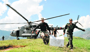 Soldiers offload aid material from an IAF copter in Jammu