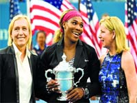 Serena Williams with Martina Navratilova (L) and Chris Evert
