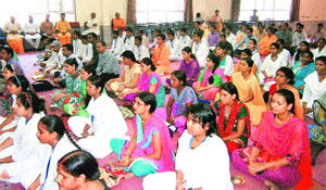 Students of distance learning courses take part in gyan deeksha programme at Dev Sanskriti University in Haridwar on Monday.