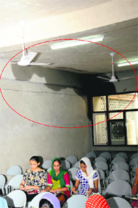 Rain water seepage at a classroom in Senior Secondary Residential School for Meritorious Students in Bathinda on Tuesday.