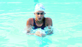 Kawalpreet of the GCG, Ludhiana, takes part in an event during the Panjab University Inter-College Swimming Championship on Tuesday.