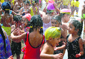 Children have fun during a monsoon party at St Soldier School in Mohali.