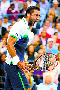 Marin Cilic reacts after winning a point en route his straight sets victory over Kei Nishikori in the US Open final in New York on Monday. 