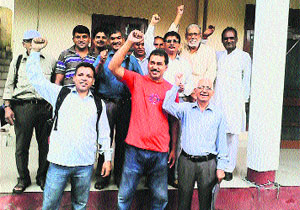 Uttarakhand Parivartan Party members raise slogans in supoport of their demands in front of the office of DM in Dehradun on Monday.