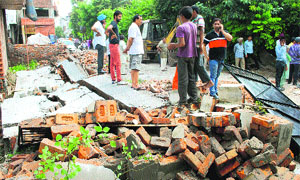The forest department officials carry out anti-encroachment drive in Professor Colony located in Tilak Nagar, Amritsar, on Wednsday. 