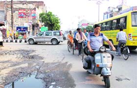 A scooterist without a helmet comes from the wrong side near Fauji Chowk in Bathinda