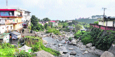 Houses on the bank of a rivulet in Dharamsala.