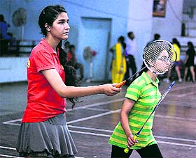 Players in action during the state-level school badminton championship at the Raizada Hansraj Stadium in Jalandhar.