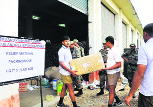 Jawans load relief material for the flood-affected residents of Jammu and Kashmir at the military station, Dholewal, in Ludhiana.