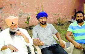Bikram Babbi (centre) with Mahinderpal Singh (left) and Harwinder Singh in Dhanaula on Wednesday