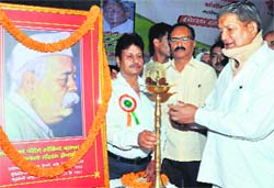 Chief Minister Harish Rawat lights a lamp during the birth anniversary function of Pandit Govind Ballabh Pant in Dehradun on Wednesday. A Tribune photograph