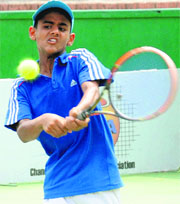 Rishabh Sharda returns a shot during a match at the CLTA Tennis Courts in Chandigarh on Thursday.